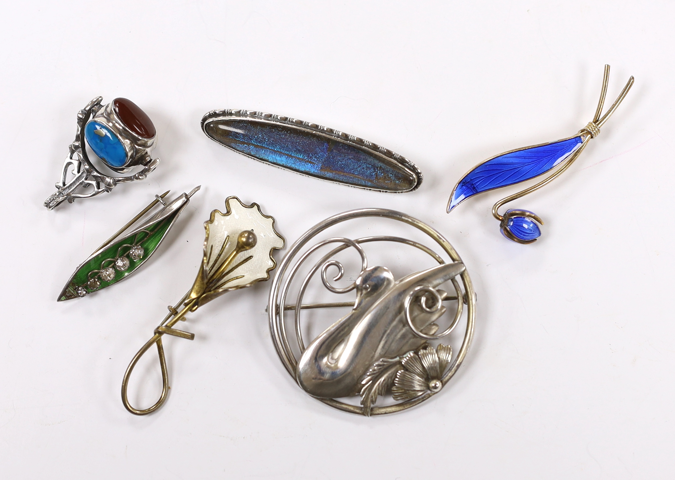 Two Norwegian sterling and enamel foliate spray brooches, largest 60mm, two sterling brooches including circular swan brooch, a modern silver, paste and enamel set leaf brooch and a modern silver and gem set spinning fob
